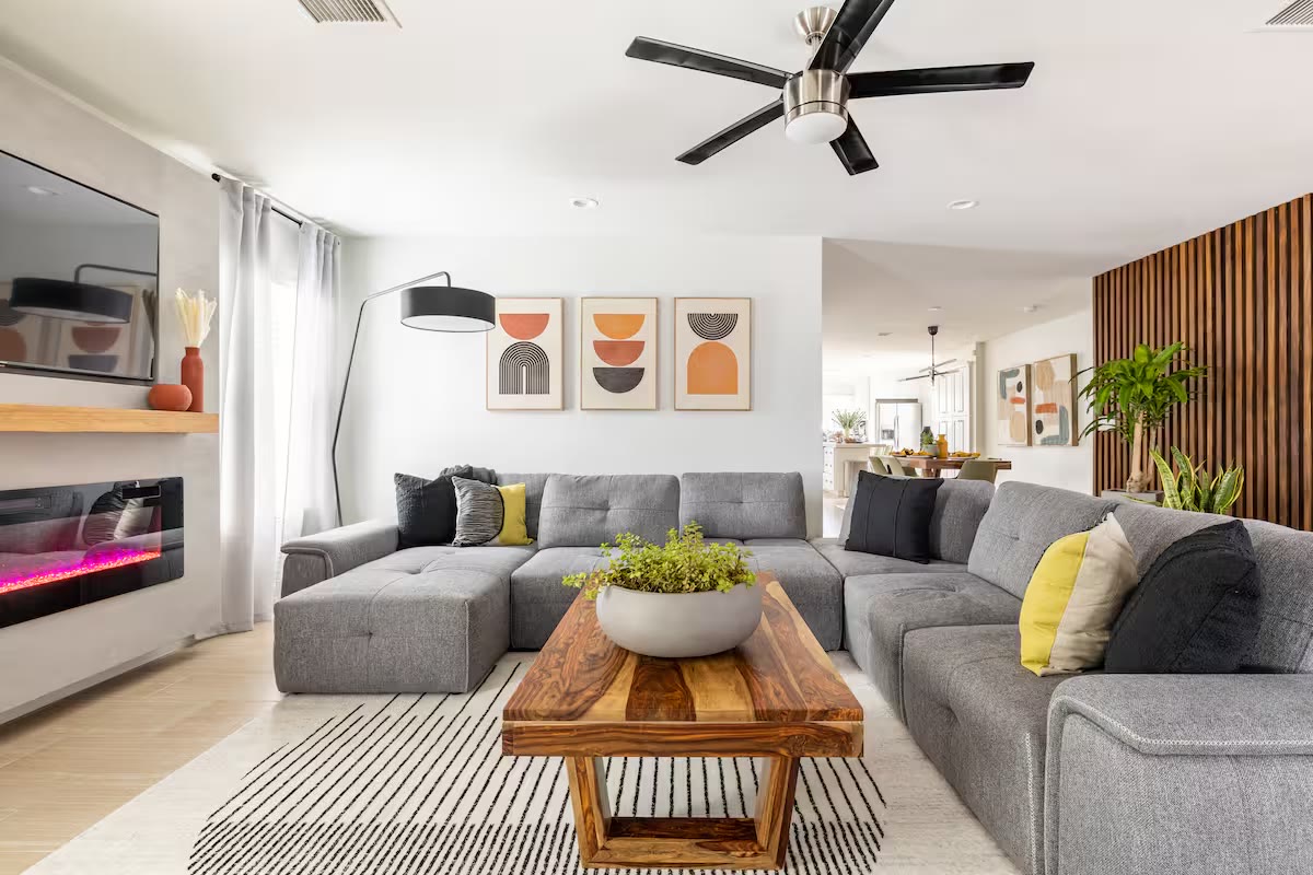 Stylish & Perfect for Families living room with fireplace at a direct-booking vacation rental in Phoenix, Arizona
