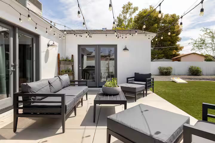 Stylish & Perfect for Families - Covered Patio Lounge Stylish & Perfect for Families covered patio lounge at a direct-booking vacation rental in Phoenix, Arizona