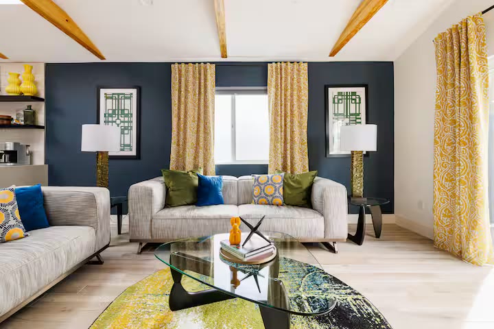 Modern All-En-Suite Home living room media wall at a direct-booking vacation rental in Phoenix, Arizona