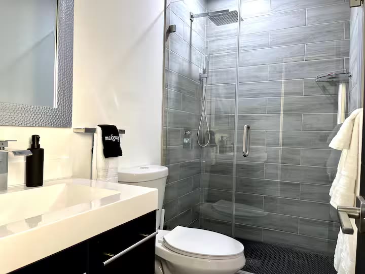 Modern All-En-Suite Home bathroom shower at a direct-booking vacation rental in Phoenix, Arizona