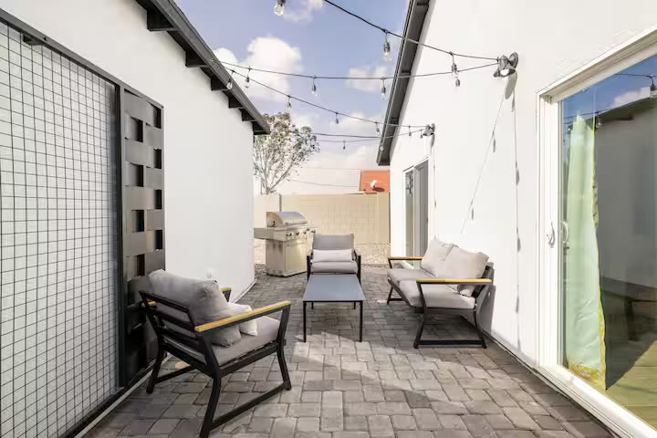 Modern All-En-Suite Home patio seating at a direct-booking vacation rental in Phoenix, Arizona