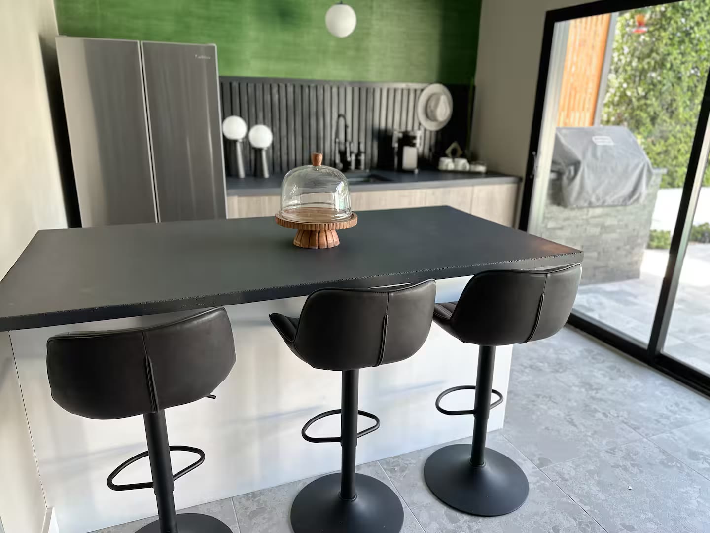 Palm Haven Pool House kitchen island at a direct-booking vacation rental in Phoenix, Arizona