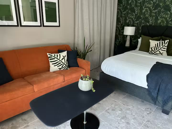 Palm Haven Pool House bedroom sitting area at a direct-booking vacation rental in Phoenix, Arizona