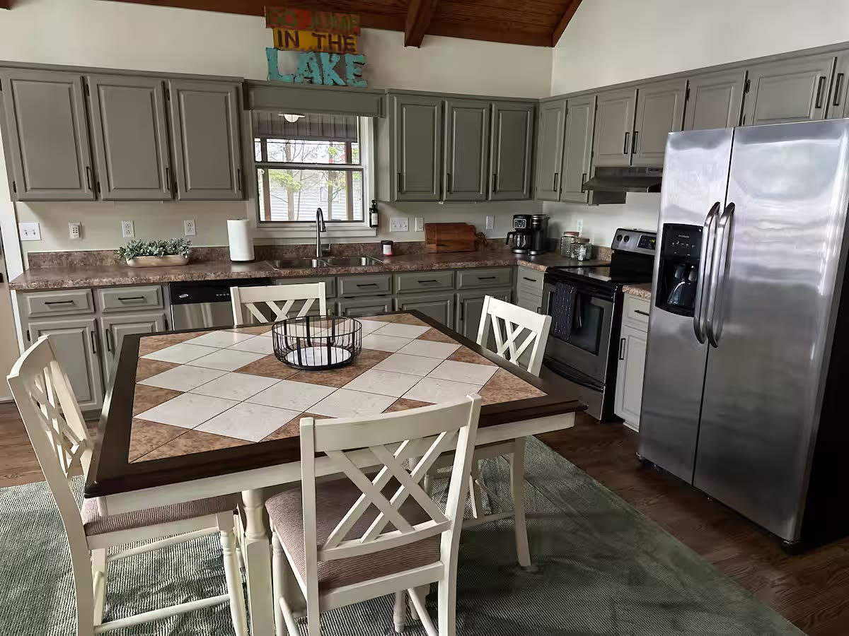 The Angler's Canoe Lake House - Kitchen Dining Area The Angler's Canoe Lake House kitchen dining area at a direct-booking vacation rental in Cedar Bluff, Alabama
