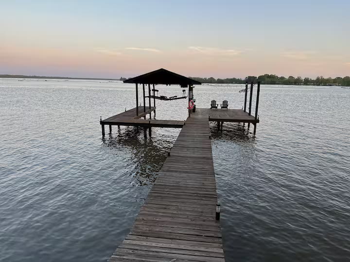 The Angler's Canoe Lake House - Waterfront Dock The Angler's Canoe Lake House waterfront dock at a direct-booking vacation rental in Cedar Bluff, Alabama