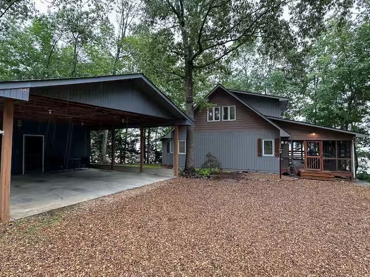 The Angler's Canoe Lake House - Covered Carport The Angler's Canoe Lake House covered carport at a direct-booking vacation rental in Cedar Bluff, Alabama